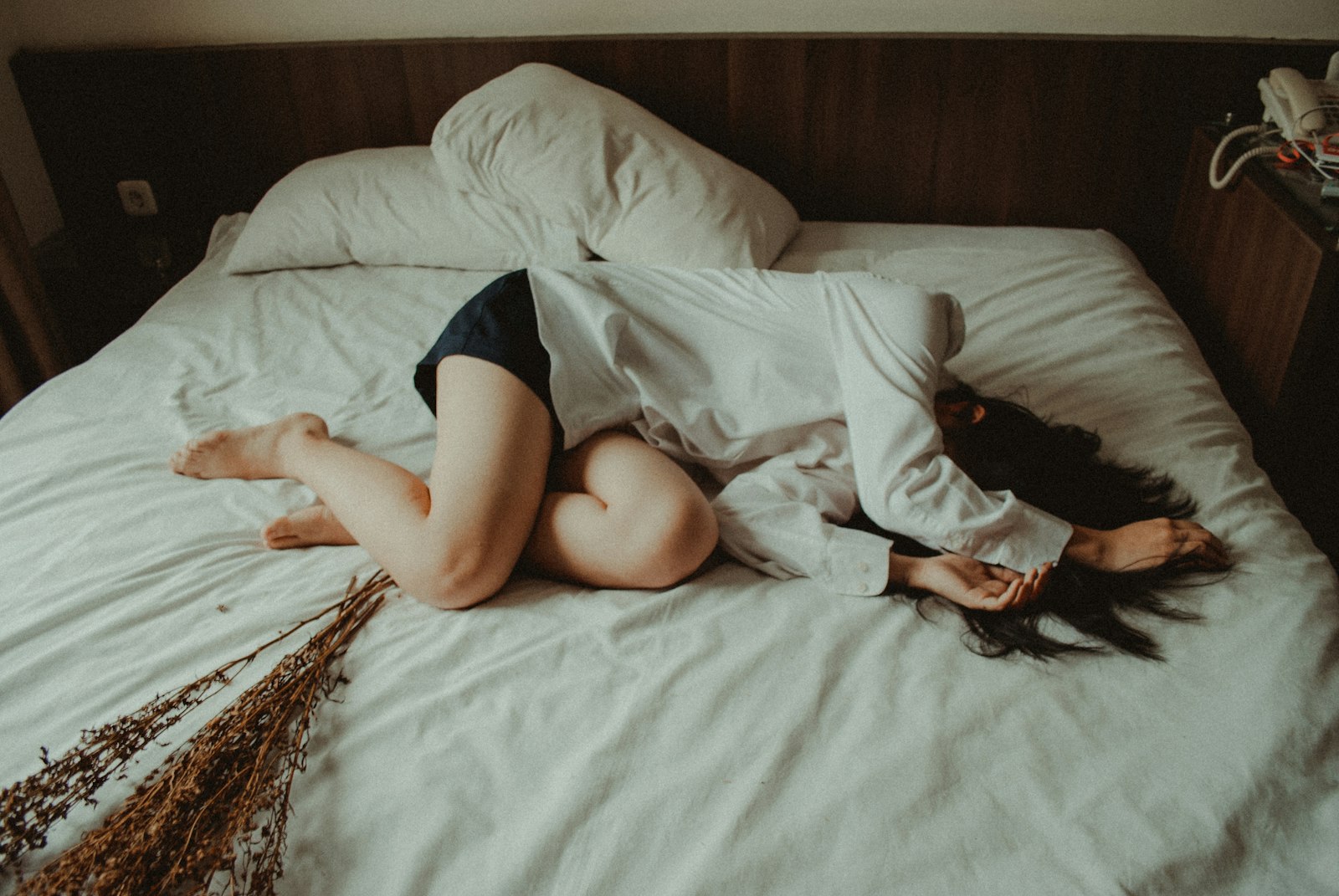 Tired woman resting her head on a pillow, a picture of everyday fatigue