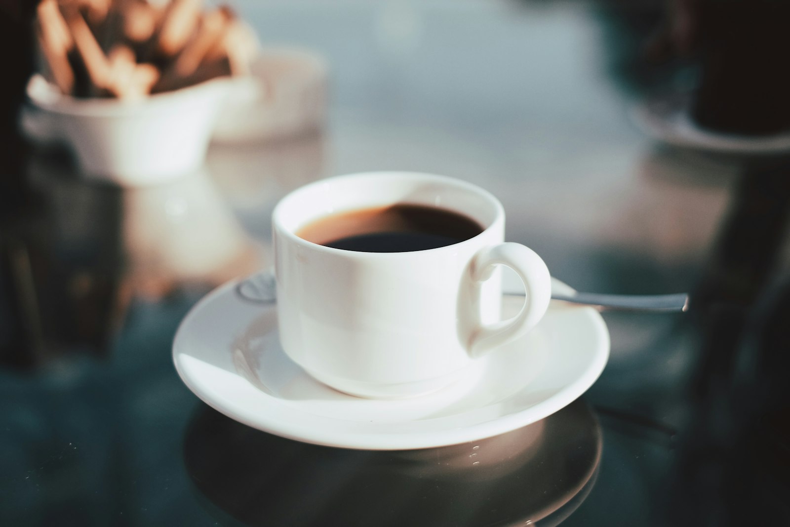 Cup of black coffee on a saucer